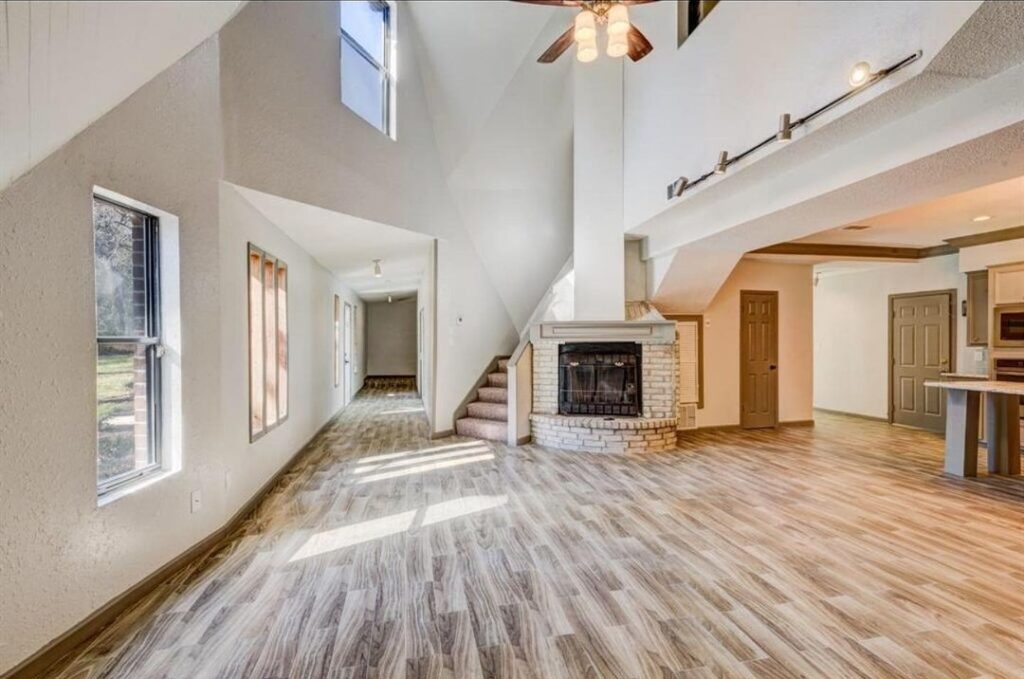 Cozy Rustic Foyer with Fireplace, Wooden Beams, and Stone Hearth - Warm and Inviting Home Interior Design in Seattle