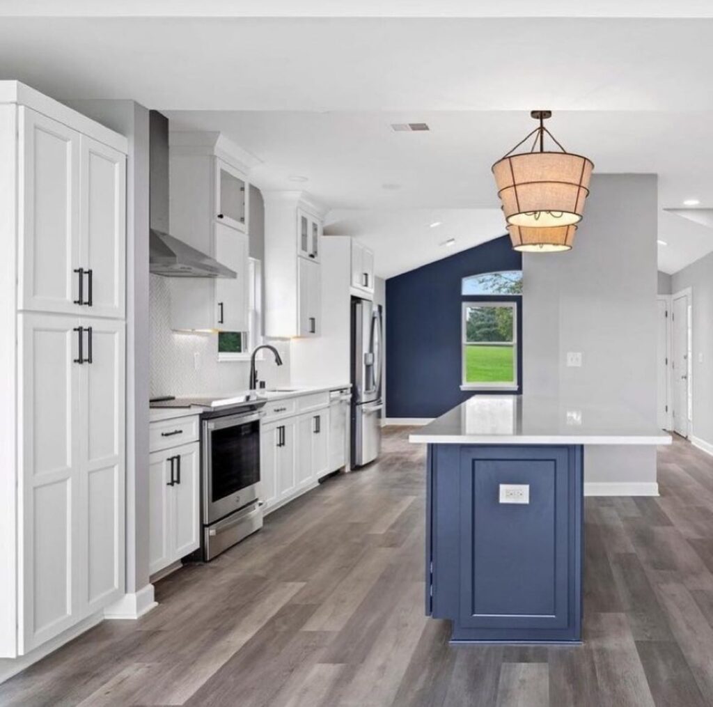 Beautifully Finished Modern Kitchen Renovation in Seattle with White and Navy Blue Accents, Wooden Vinyl Flooring